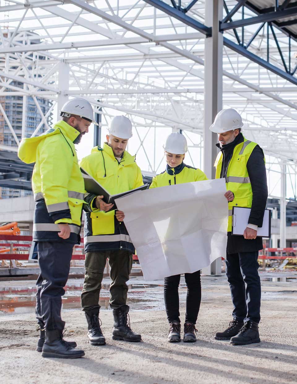 employees reviewing new construction site